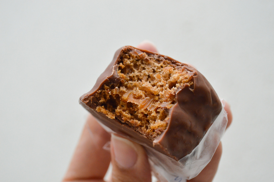 Person's Hand Holding a Brazilian Pão de Mel